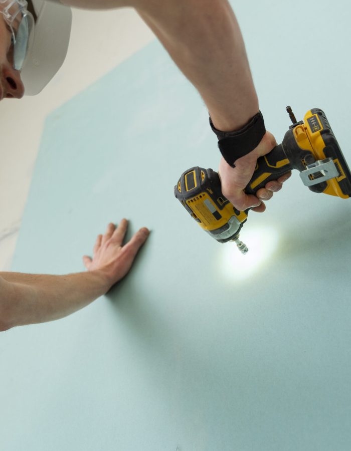 man-working-with-drill-low-angle